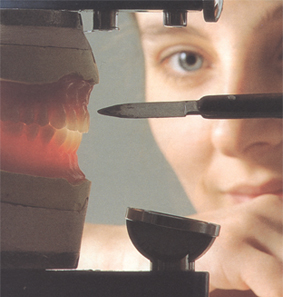 Dental student working in a laboratory, c2002.